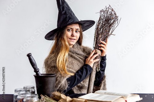 Murais de parede A young woman wearing a witch costume