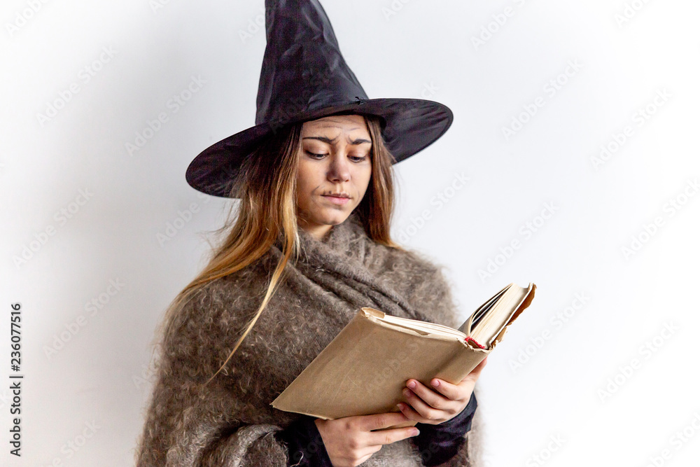 A young woman wearing a witch costume A young woman wearing a witch costume
