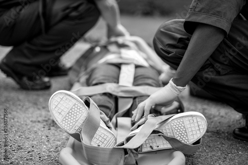 Paramedic team rescuing a young critical patient