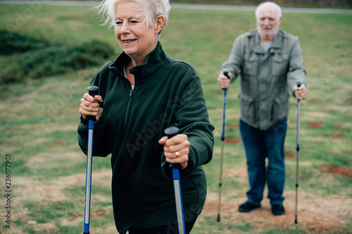 Fototapeta Naklejka Na Ścianę i Meble -  Active seniors with trekking poles