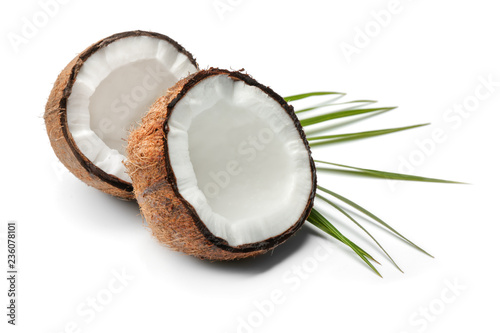 Cut ripe coconut on white background