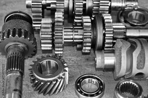 Gears of motorcycle engine. / Selective focus. / Black and white.