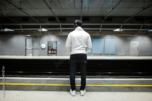 Man waiting at a subway station
