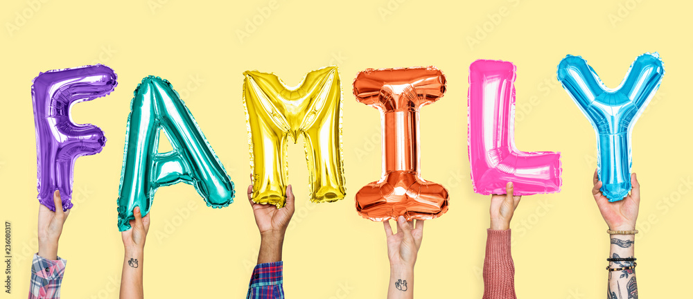 Hands showing family balloons word