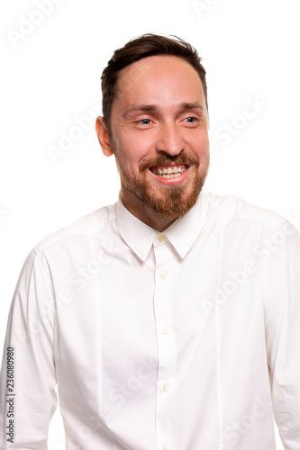 Stylish bearded business man smiling to camera, having pleased expression and cheerful look.
