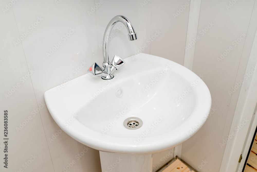 Fototapeta premium The photo of a sink in a bathroom