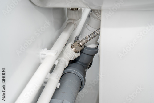 The photo of the established plastic pipes for water supply