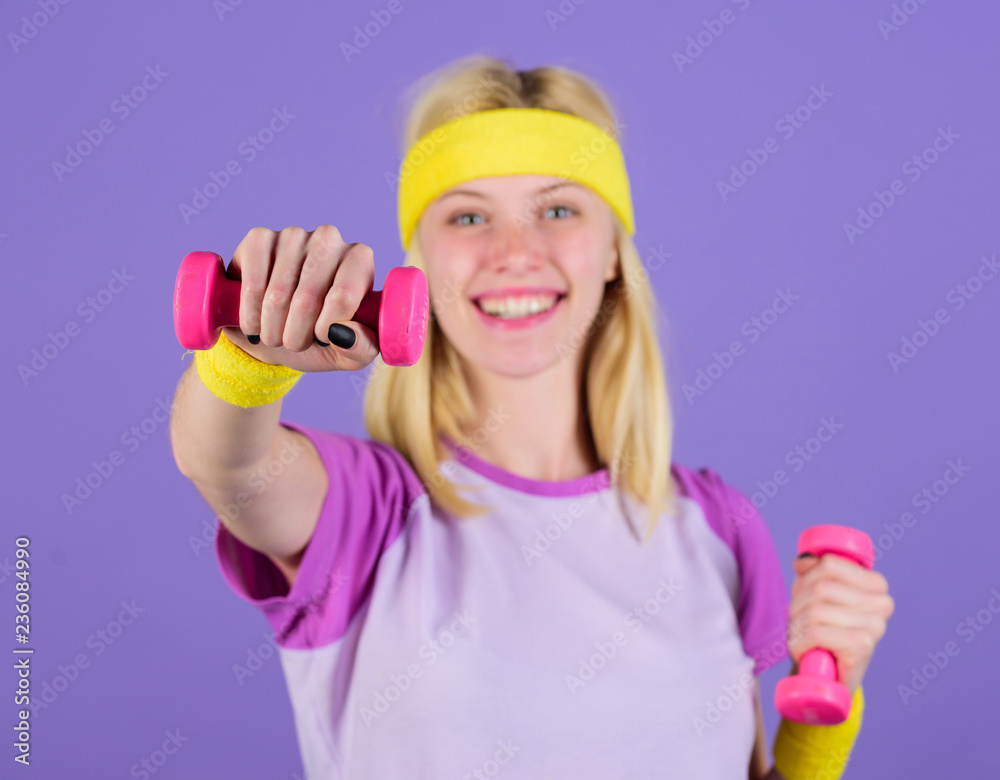 Sport motivation concept. Woman exercising with dumbbells. Exercises with dumbbells. Workout with dumbbells. Biceps exercises for women step by step guide. Girl strong hold dumbbells wear wristbands Sport motivation concept. Woman exercising with dumbbells. Exercises with dumbbells. Workout with dumbbells. Biceps exercises for women step by step guide. Girl strong hold dumbbells wear wristbands