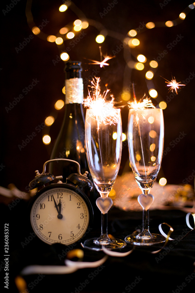 Sylwester, Andrzejki's toast for two. Champagne and fortune telling on a black background. Celebration, lights and new year - obrazy, fototapety, plakaty 
