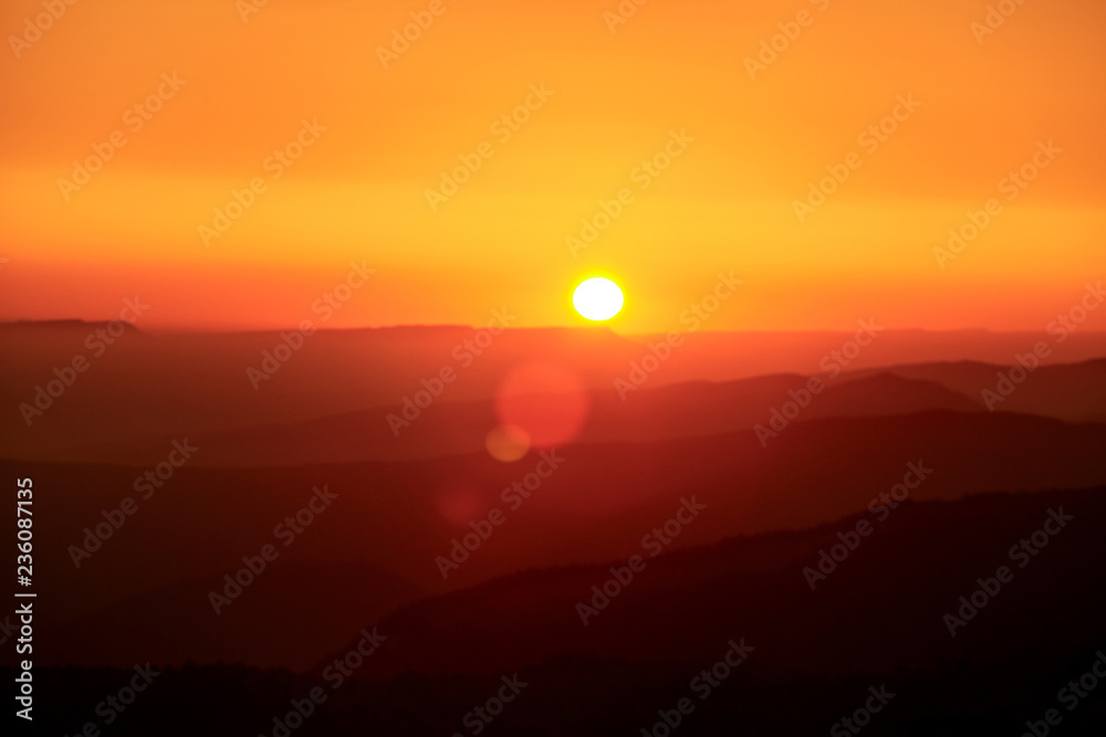 Landscape with mountains and the sun. Sunset. Mountain landscape. Abstract background