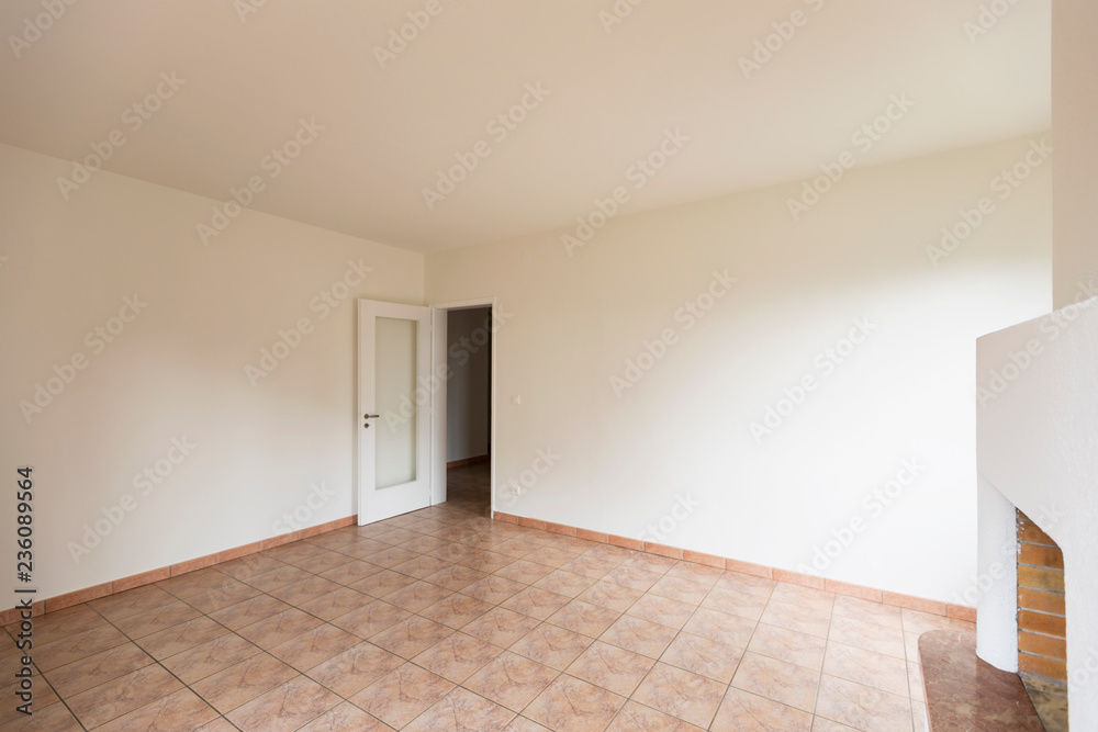 Empty room with open door, natural light Empty room with open door, natural light