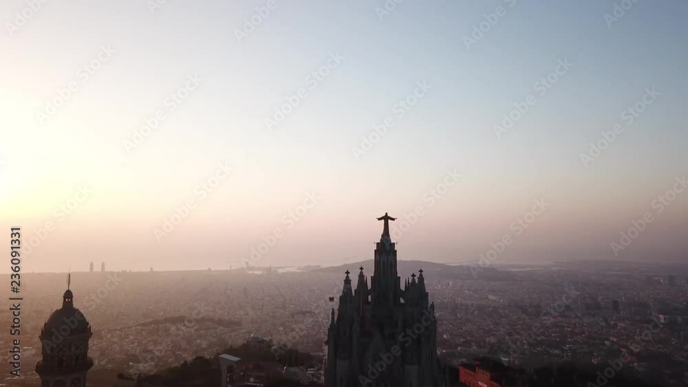 drone shot over tibidabo in Barcelona 4k, jesus christ statue in barcelona