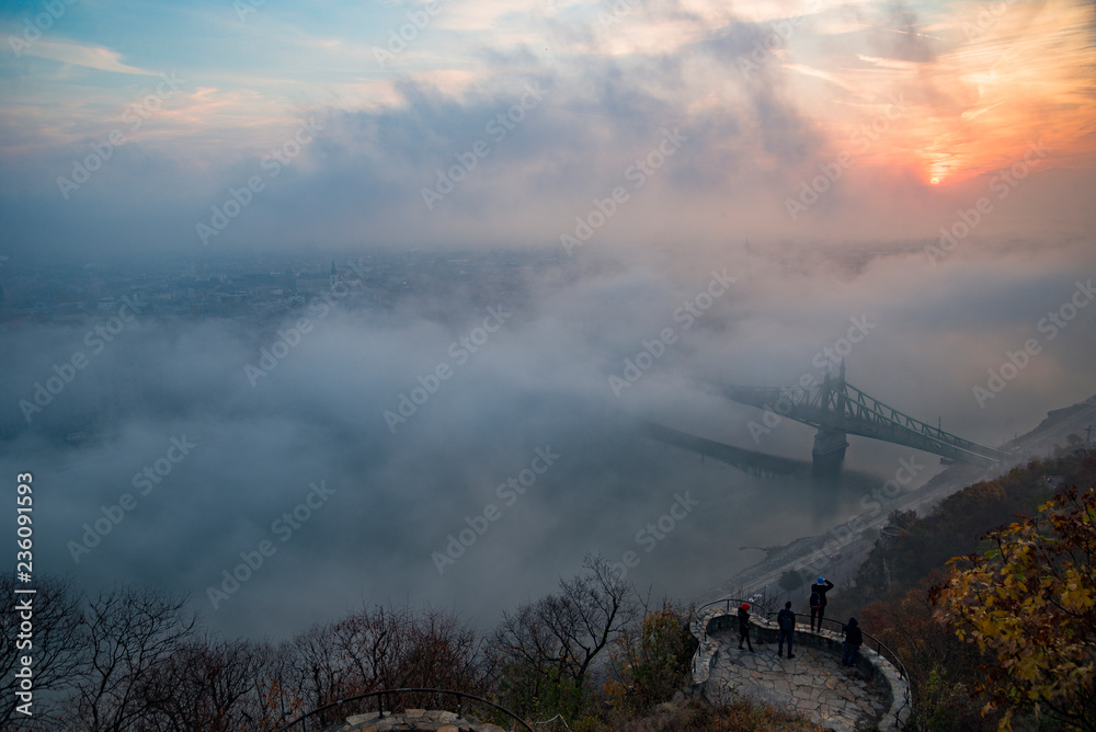 Obraz premium floating fog in Budapest sunrise at Citadella Gellert hill
