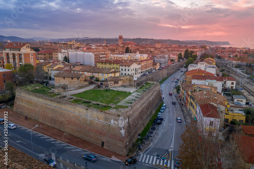 Aerial panorama of popular travel destination beach town Fano in Italy with sunset blue, red, purple sky near Rimini in the Marche region.