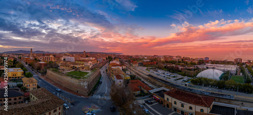 Aerial panorama of popular travel destination beach town Fano in Italy with sunset blue, red, purple sky near Rimini in the Marche region. photo