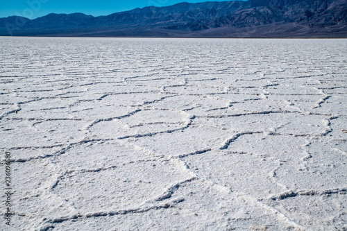 Close view of the Bad Water salt field in the lowest point of North America. An impressive atmosphere in the huge valley copmpletely covered by salt.