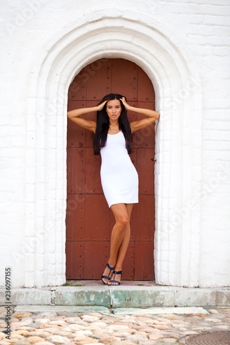 Beautiful young woman in white sexy dress © Andrey_Arkusha