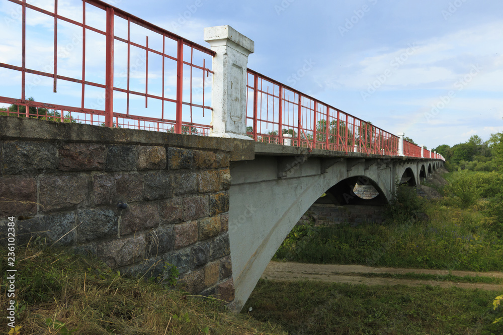 Fototapeta premium Bridge over the kasari River in summer.