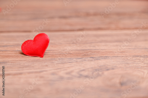 Valentine's day red heart on wooden background. Holidays background. Love card. Selective focus