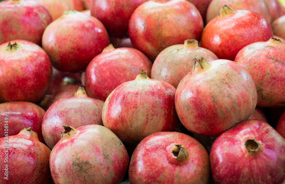 Ripe Pomegranates. Bright fruit background (Selective focus) Ripe Pomegranates. Bright fruit background (Selective focus)