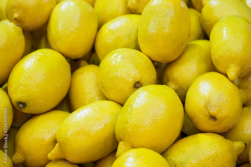 Fresh lemon for sale in local market. Agriculture and fruits product. (Selective focus) Fresh lemon for sale in local market. Agriculture and fruits product. (Selective focus)