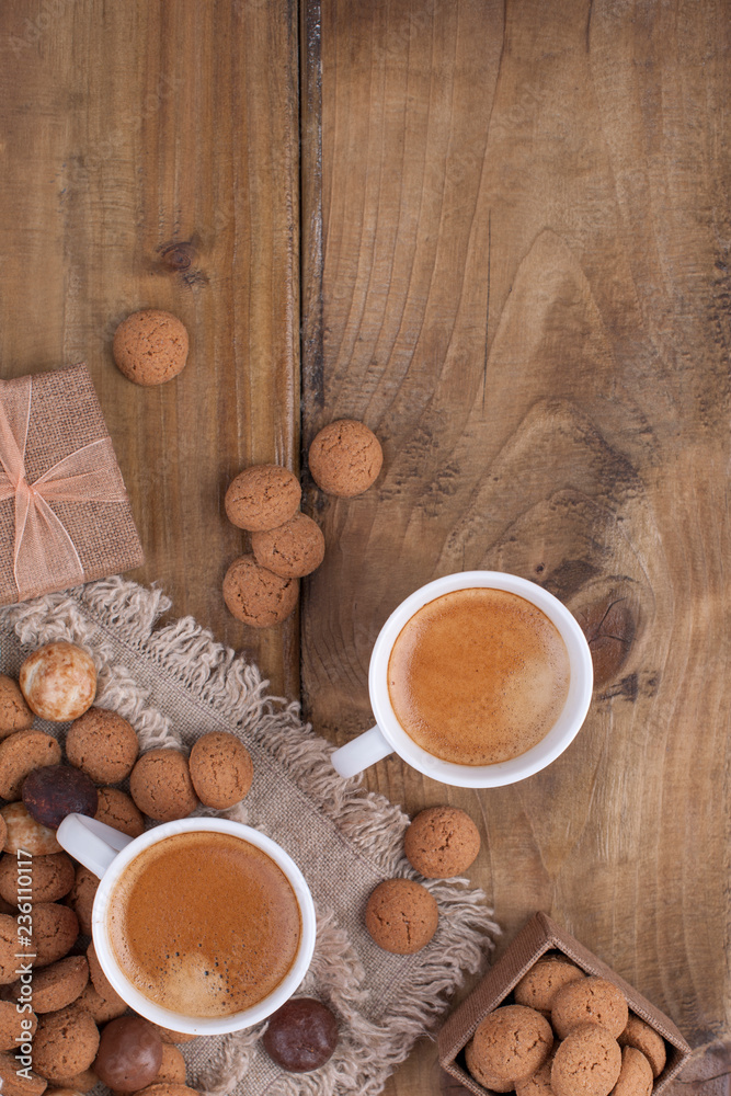 Fototapeta premium St. Nicolas day concept. Dutch holiday Sinterklaas, festive breakfast with coffee, kruidnoten, traditional sweets and presents. Top view. Free space for text.