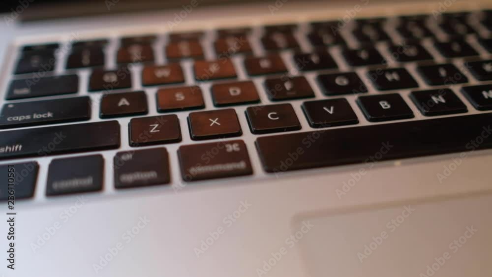 Close-up of laptop keyboard with focus buttons key. Royalty high-quality stock video footage of laptop keyboard buttons. blurry background and focus computer keyboard Close-up of laptop keyboard with focus buttons key. Royalty high-quality stock video footage of laptop keyboard buttons. blurry background and focus computer keyboard