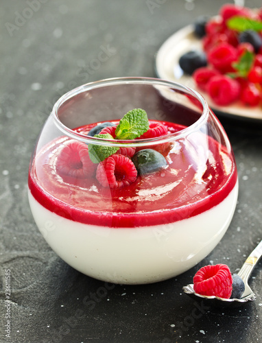 Obraz na płótnie Delicious Italian dessert panna cotta with berries and berry sauce. Valentine's Day. w salonie