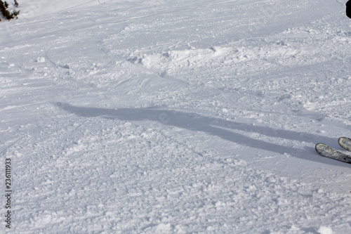 Shadow of a skier in the snow in winter