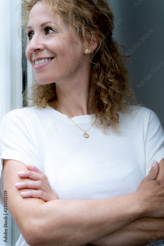 Portrait of smiling woman with arms crossed Portrait of smiling woman with arms crossed