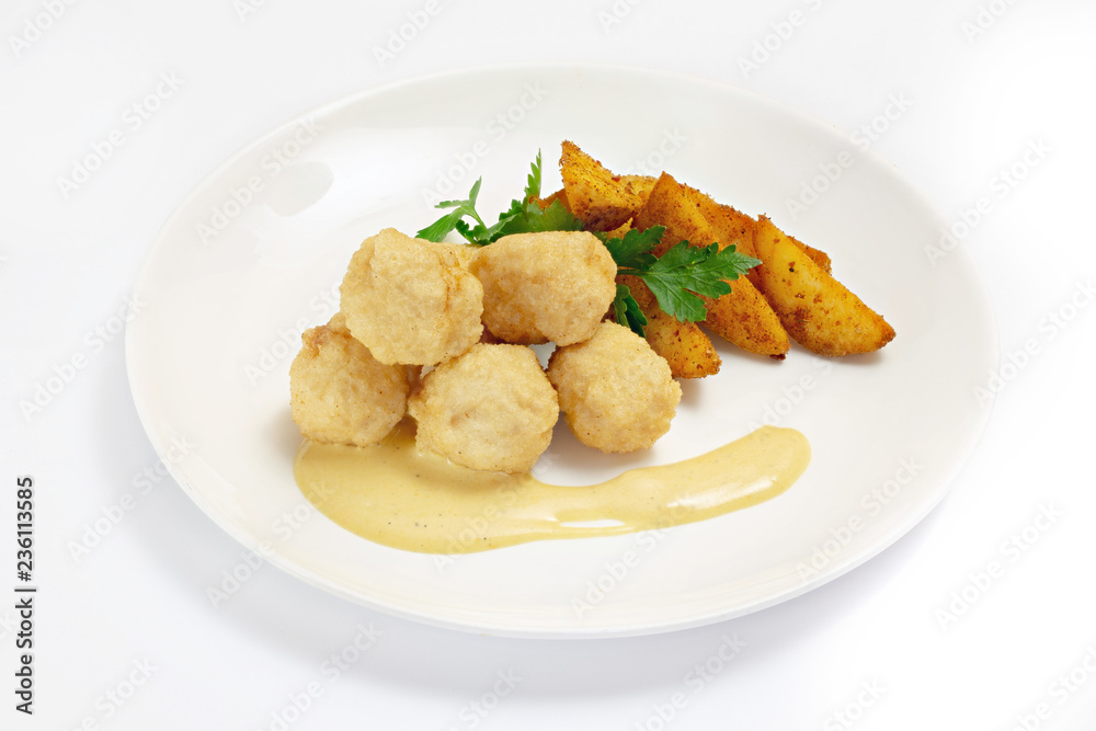 Roasted meat and vegetables on a white background Roasted meat and vegetables on a white background