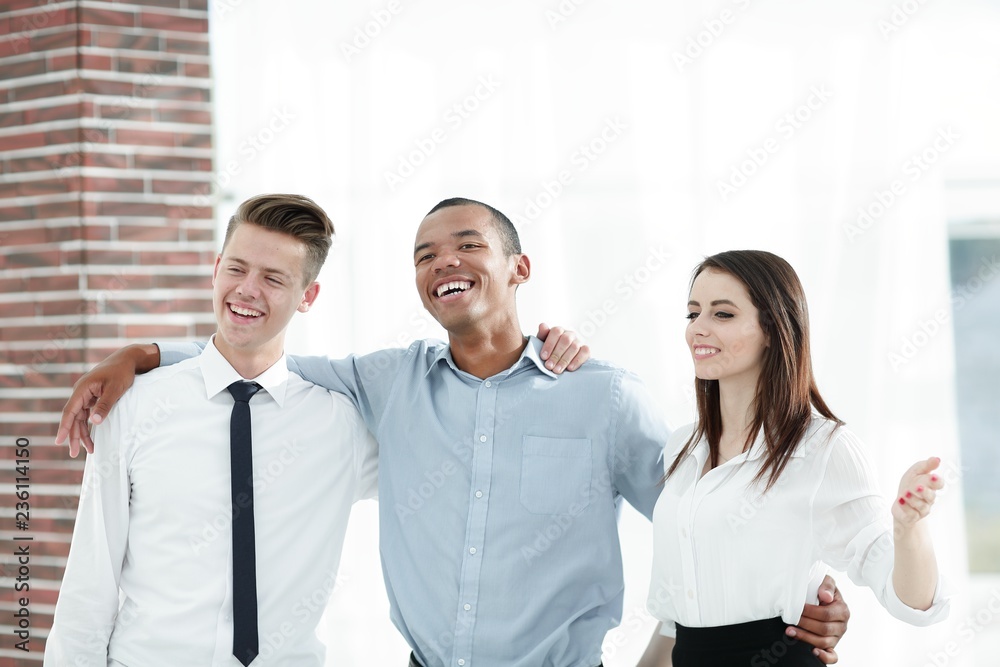 very happy business team in the background of the office.