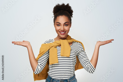 Young woman studio isolated in white hands aside presenting look