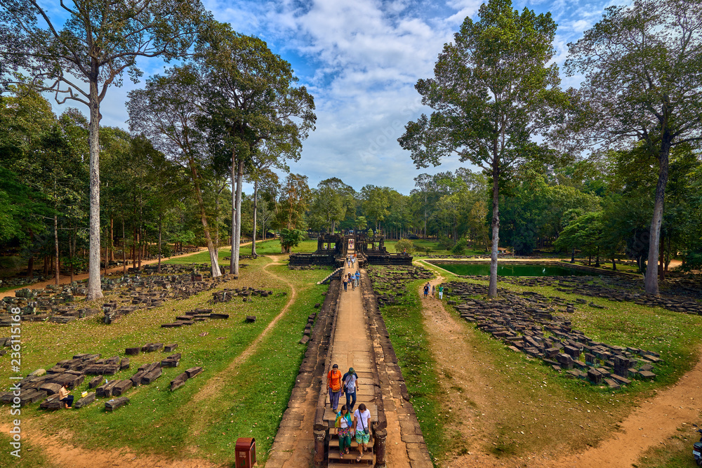 Fototapeta premium SIEM REAP, CAMBODIA - 13 December 2014:View of Baphuon temple at Angkor Wat complex is popular tourist attraction, Angkor Wat Archaeological Park in Siem Reap, Cambodia UNESCO World Heritage Site