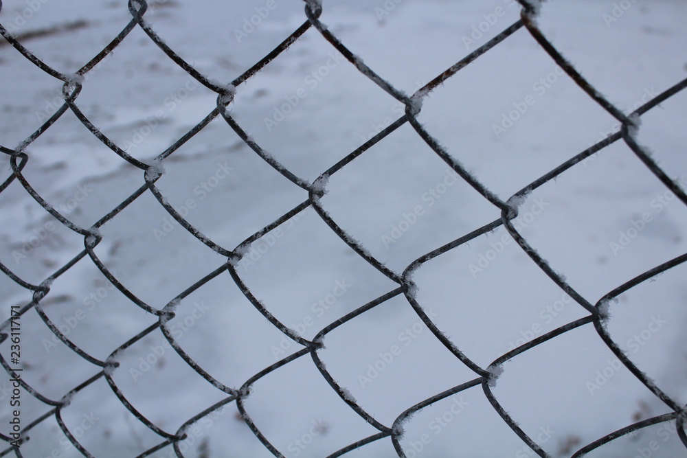 Fototapeta premium chain link fence with barbed wire