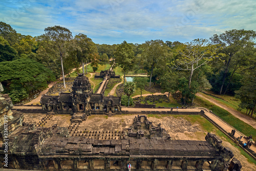 SIEM REAP, CAMBODIA - 13 December 2014:View of Baphuon temple at Angkor Wat complex is popular tourist attraction, Angkor Wat Archaeological Park in Siem Reap, Cambodia UNESCO World Heritage Site photo