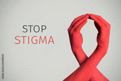 red awareness ribbon and text stop stigma photo