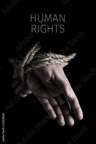 man tied up and text human rights photo