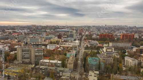 Urban aerial view photo from drone of downtown skyline. Cityscape of Dnipro city in Ukraine on the background of the sky.