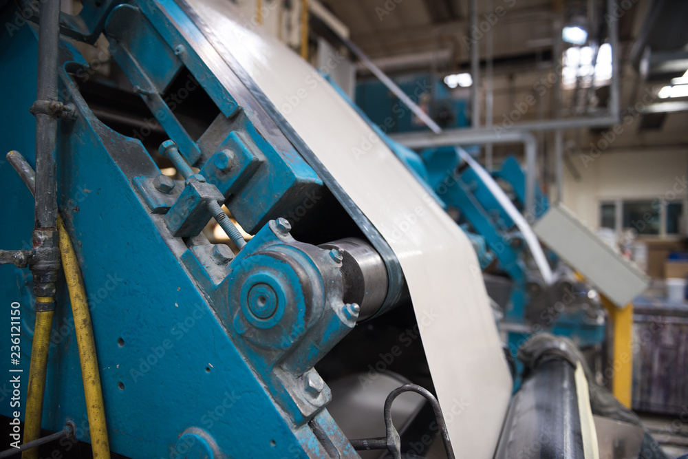 An empty quiet industrial wallpaper and paint factory with giant