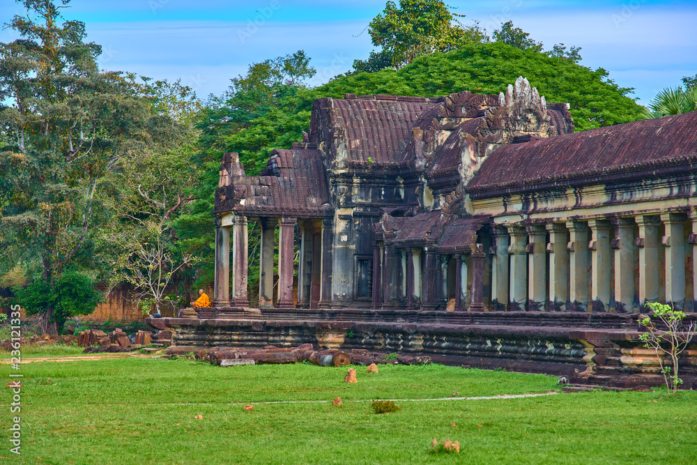 SIEM REAP, CAMBODIA - 13 December 2014:Buddhist monks in Angkor Wat complex, popular tourist attraction, Angkor Wat Archaeological Park in Siem Reap, Cambodia UNESCO World Heritage Site SIEM REAP, CAMBODIA - 13 December 2014:Buddhist monks in Angkor Wat complex, popular tourist attraction, Angkor Wat Archaeological Park in Siem Reap, Cambodia UNESCO World Heritage Site