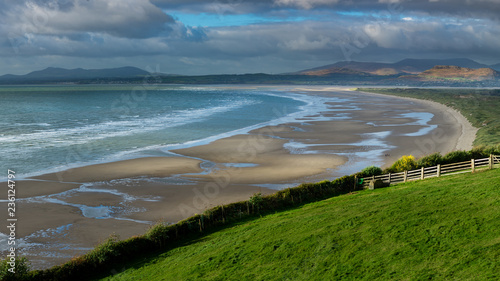 Harlech Beach at low tide on stormy day with views to Anglesey & Snowdonia