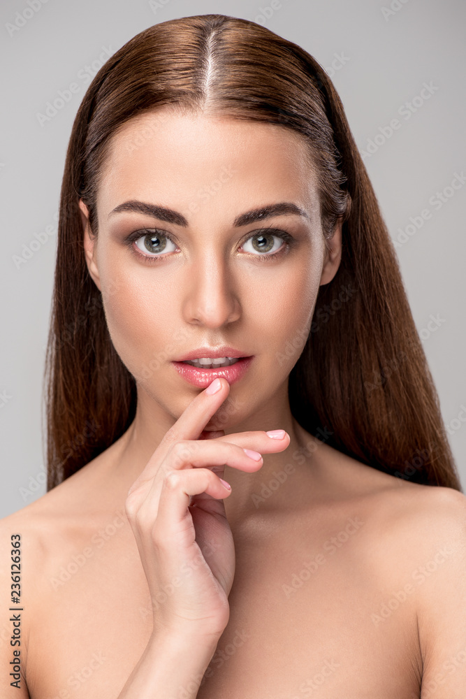portrait of beautiful pensive woman with brunette hair, isolated on grey portrait of beautiful pensive woman with brunette hair, isolated on grey