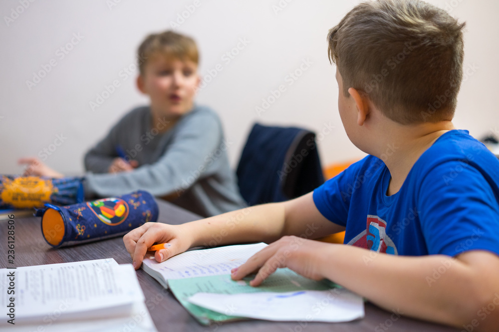 The brothers do their boring homework homework. The brothers do their boring homework homework.