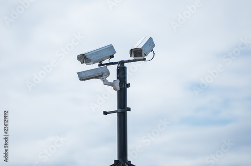 Rustic urban city surveillance cctv video monitoring cameras, spying on civilians. big brother is watching you.