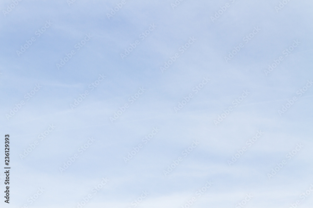 Blue sky with white porous clouds in summer