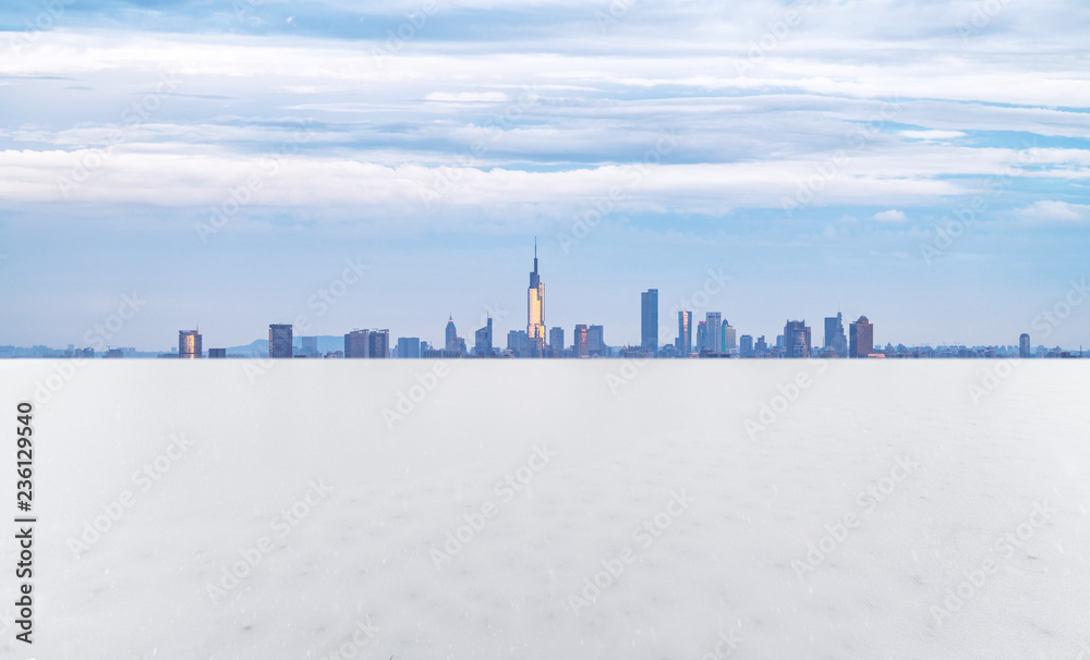 Panoramic skyline and buildings with empty snow ground