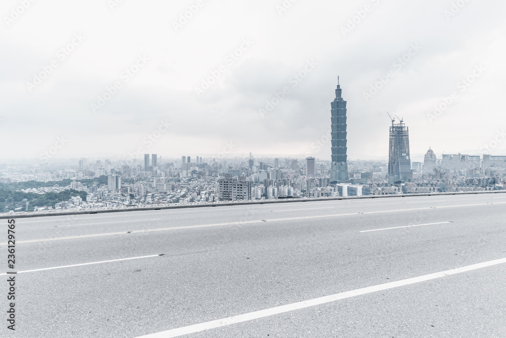 Panoramic skyline and modern buildings with empty road in Taiwan