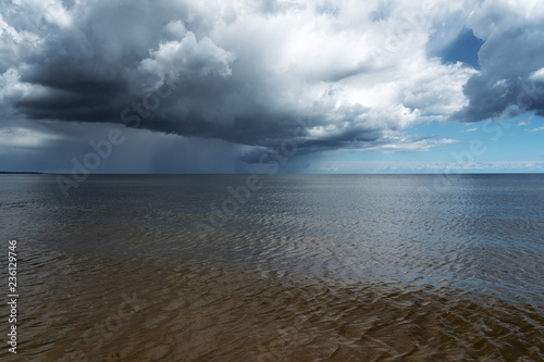 Fototapeta Naklejka Na Ścianę i Meble -  Dark clouds over gulf of Riga, Baltic sea.