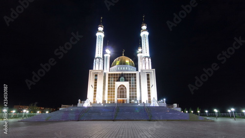 Mosque Nur Gasyr in the city of Aktobe night timelapse hyperlapse. Kazakhstan photo